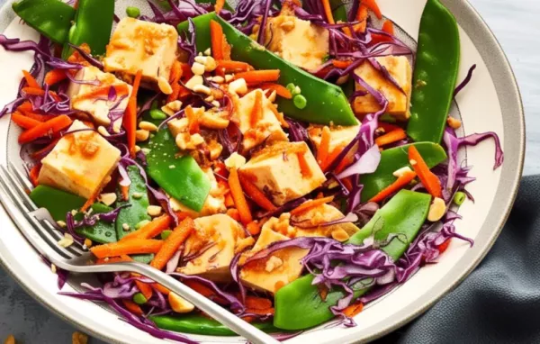 A delicious and nutritious tofu salad with a variety of fresh vegetables and a tangy dressing.