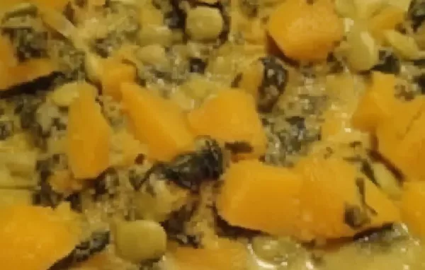 A hearty and flavorful vegetarian curry made with pumpkin, butter beans, and spinach