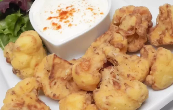 Crispy and flavorful deep-fried cauliflower with a tangy lemon sauce