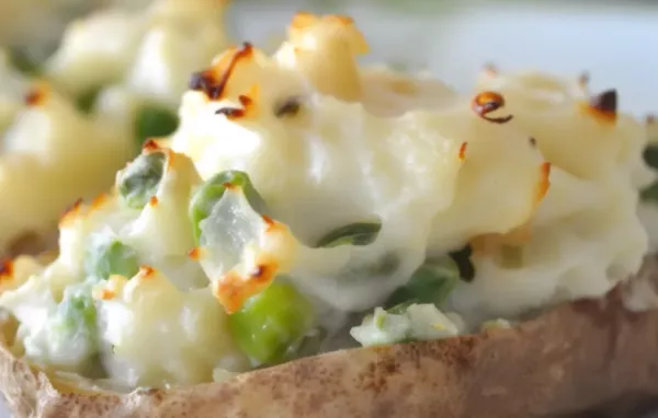 Delicious and nutritious stuffed baked potatoes filled with a variety of garden-fresh vegetables and herbs.