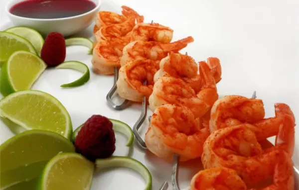 Delicious and tangy prawn skewers with a sweet raspberry dipping sauce