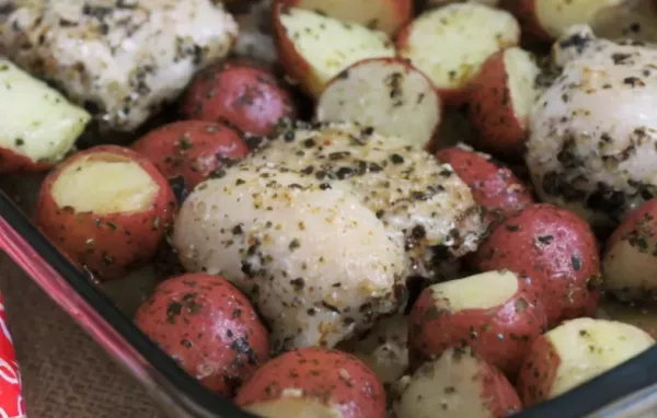 Delicious Baked Pesto Chicken Thighs with crispy potatoes