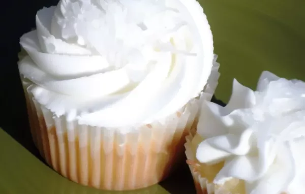 Delicious Coconut Cupcakes with Creamy Almond Frosting Recipe