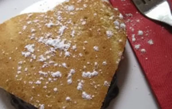 Delicious Heart-Shaped Pancakes with Decadent Chocolate Sauce