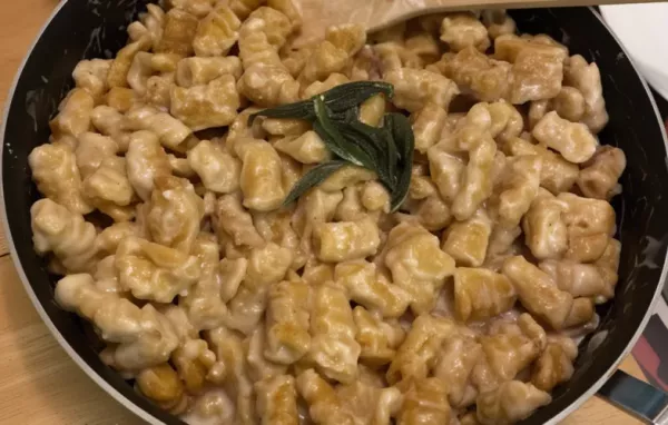 Delicious homemade pumpkin gnocchi served in a rich sage sauce.