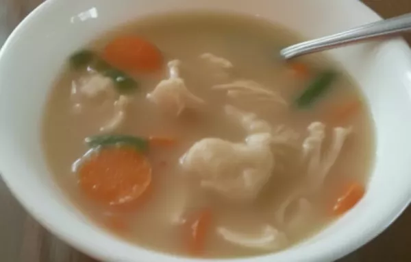 Homemade Chicken and Dumplings with Fluffy Biscuits