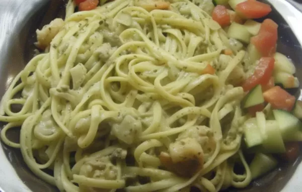 Indulge in the rich and creamy flavors of this delectable Creamy Pesto Sauce Pasta.