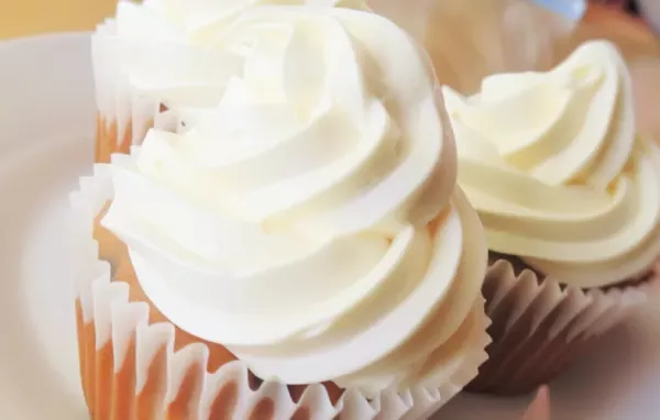 Indulge in these decadent banana chocolate chip cupcakes topped with creamy cream cheese frosting for the perfect sweet treat.