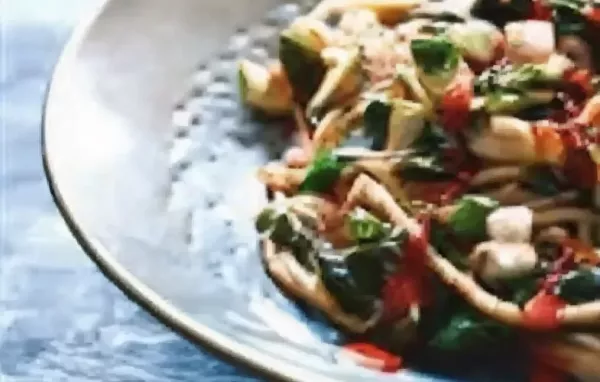 Spicy and flavorful rice noodles with vegetables, tofu, and a Korean-inspired sauce