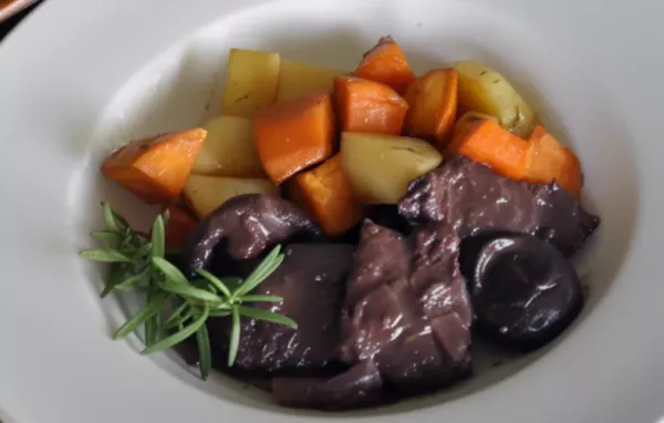 Tender and flavorful braised venison dish with a fragrant rosemary and shiitake mushroom twist