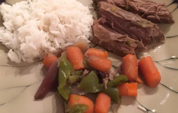 Tender and flavorful slow-cooked flank steak with a rich red wine sauce.