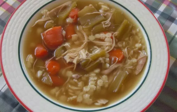 Warm up with a comforting bowl of homemade chicken soup packed with flavorful herbs and tender chicken chunks.