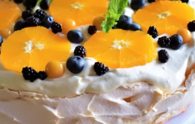 A delightful and light dessert bursting with the flavors of citrusy oranges and fresh berries on a crispy meringue base.