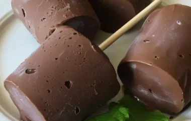 Creamy and indulgent chocolate pudding popsicles perfect for a summer treat.