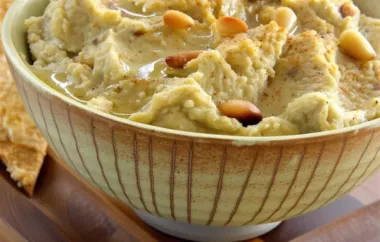 Delicious and Creamy Hummus with a Crunchy Pine Nut Topping