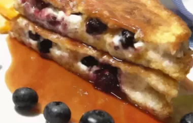 Delicious and indulgent Blueberries and Cream French Toast Sandwich with a tangy Orange Maple Syrup.