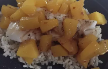 Delicious grilled grouper served with a flavorful mango butter topping.