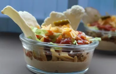 Delicious Layered Taco Dip with Savory Meat