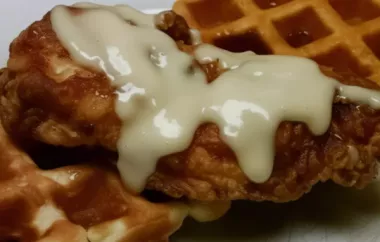 Indulge in a classic Southern dish with a twist - crispy fried chicken served on top of fluffy waffles.