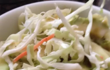 Refreshing and vibrant Puerto Rican salad with a blend of crunchy cabbage, creamy avocado, and sweet carrots