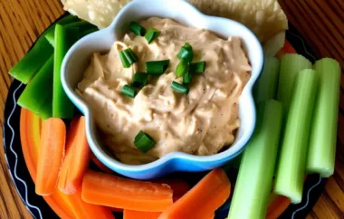 Spice up your game day with this delicious Slow Cooker Buffalo Chicken Dip!