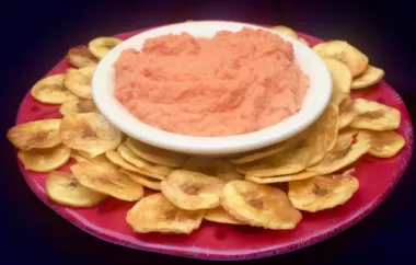 Spicy and savory red pepper cauliflower hummus served with crispy plantain chips