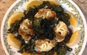 A delicious and healthy dish featuring roasted cauliflower, crispy kale chips, and zesty citrus flavors.