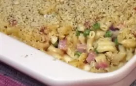 Creamy macaroni and cheese combined with savory ham, sweet peas, and caramelized shallots.