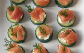 Crisp cucumber cups filled with creamy dill spread and topped with smoky salmon.