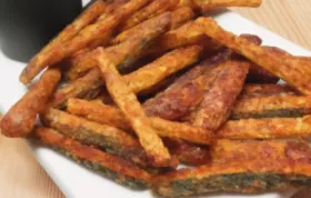 Crispy and flavorful zucchini fries coated with Parmesan cheese