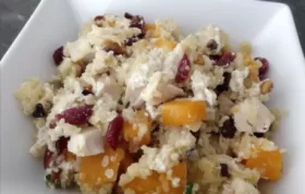 Delicious and satisfying quinoa bowl with roasted butternut squash, grilled chicken, and tangy goat cheese