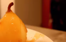 Delicious Flambéed Vanilla Poached Pears with Apricot Sauce