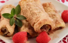 Indulge in a sweet and tangy treat with these chocolate raspberry blintzes