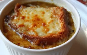 Indulge in this hearty American French Onion Soup with a rich and flavorful broth topped with melted cheese and crusty bread.