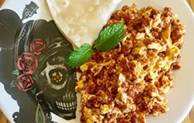 Spice up your breakfast with this flavorful scrambled eggs with chorizo recipe!