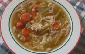 Warm up with a comforting bowl of homemade chicken soup packed with flavorful herbs and tender chicken chunks.